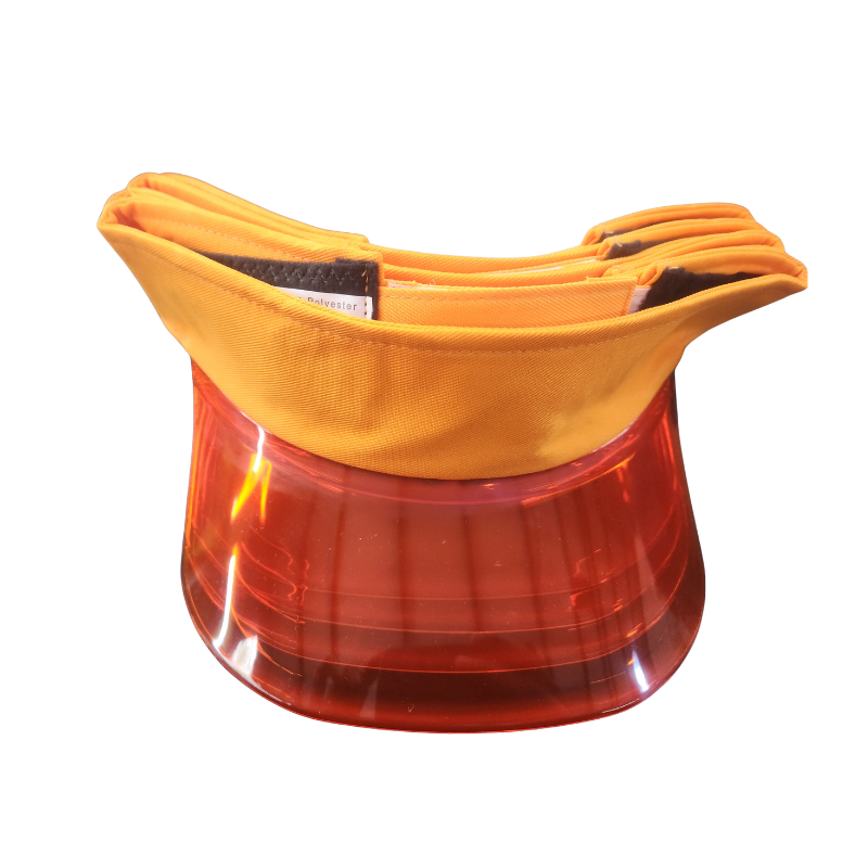 A protective visor with a bright orange fabric top and a translucent amber-red plastic lower shield, shown on a plain white background.